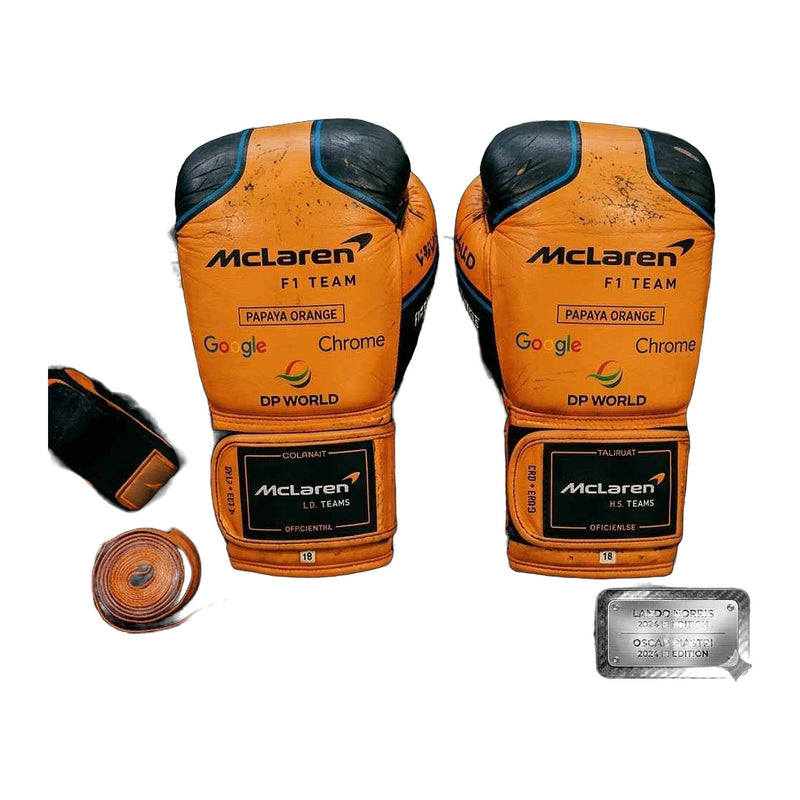Papaya orange and black racing boxing gloves, pair shown together