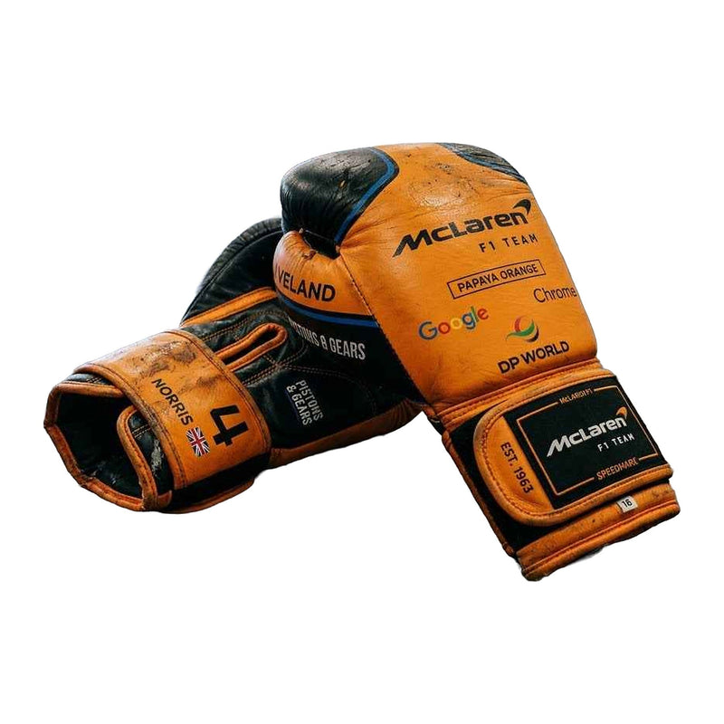 Papaya orange and black racing boxing gloves, pair shown together