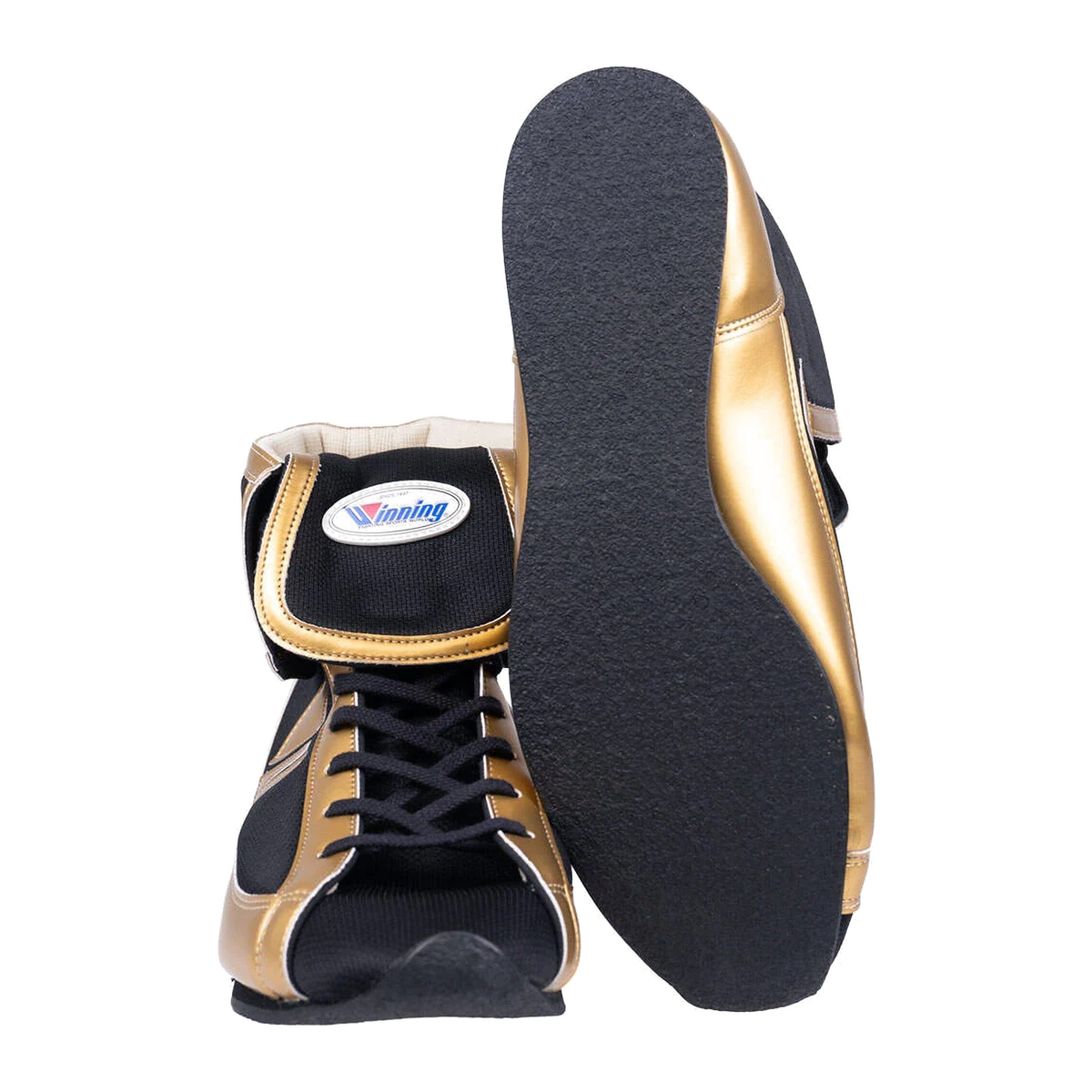Black and gold boxing shoes showing side profile and textured rubber outsole