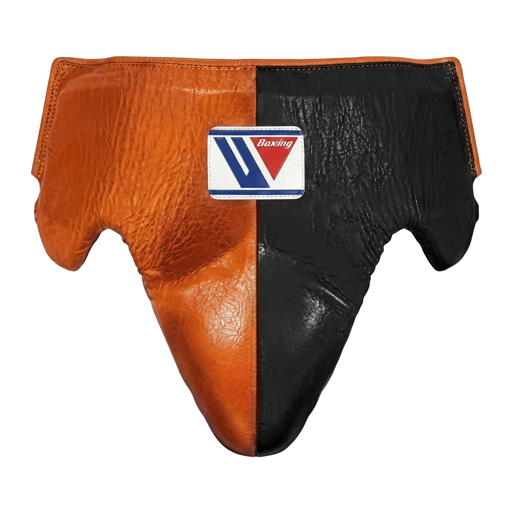 Close-up of the orange and black boxing headgear and brand logo patch